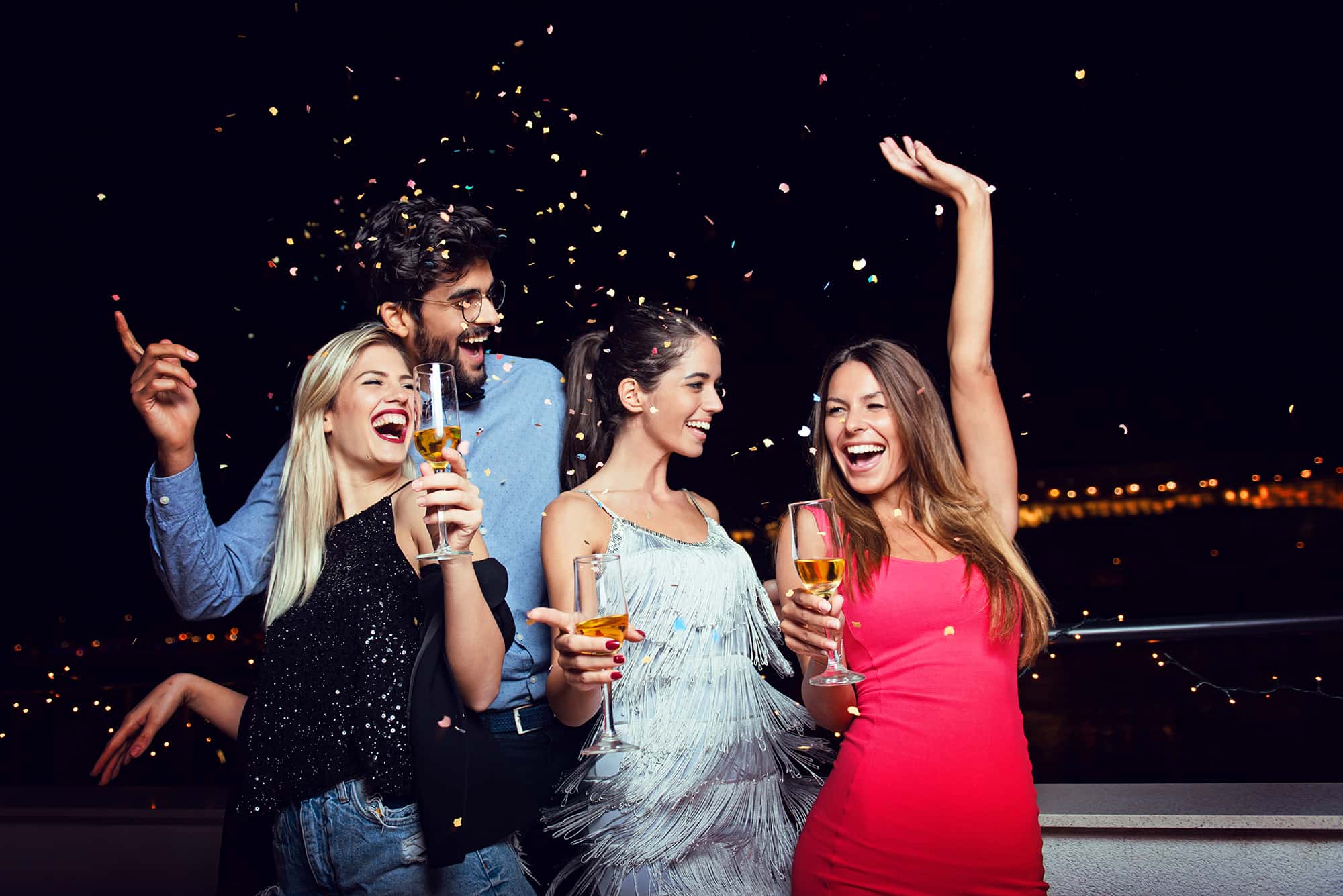 Women with champagne and a man partying